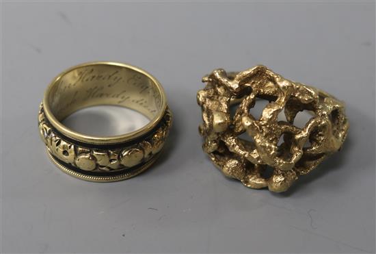 A George IV gold and black enamel mourning ring and a 9ct textured gold ring. sizes M & O respectively.